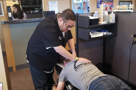 Chiropractor White Center WA Lawrence Clayman Adjusting Patient